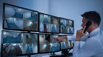 Security System Operator Looking At Cctv Footage