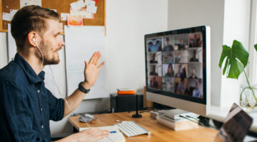 Business,video,conferencing.,young,man,having,video,call,via,computer
